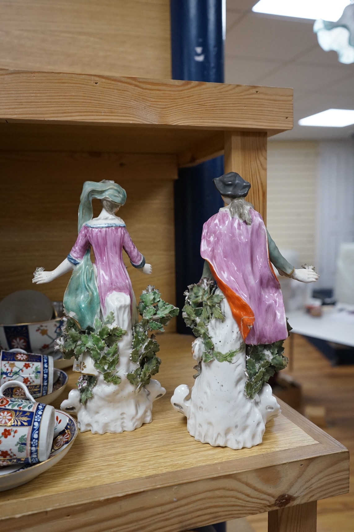 A pair of 18th century Derby porcelain figures of a lady and gentleman, 27cm high